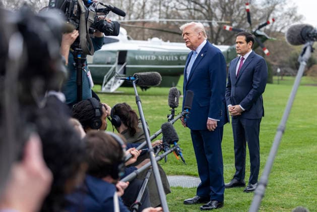 US President Donald J. Trump departs the White House to spend the weekend at Mar-a-Lago United States President Donald J Trump, with US Secretary of State Marco Rubio, responds to a question from the news media as they prepare to board Marine One on the South Lawn of the White House in Washington, DC, USA, 20 March 2026. The President is scheduled to spend the weekend at his Mar-a-Lago Resort in Palm Beach, Florida. Credit: CNP AdMedia Washington District of Columbia United States of America EDITORIAL USE ONLY  Copyright: xx CNPx xAdMediax admphotostwo976622