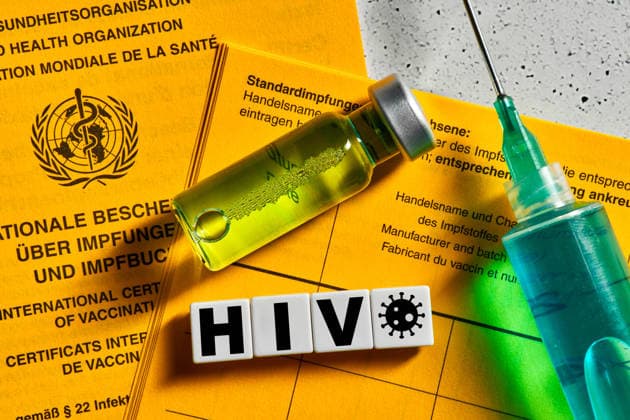 Dachau, Bavaria, Germany March 22, 2026: PHOTOMONTAGE. The letters HIV? superimposed over a vaccination card, a vaccine, and a syringe symbolize global research into an HIV vaccine. Despite advances in treatment and prevention, developing effective protection remains a key challenge.