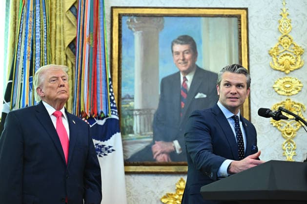 President Donald Trump looks on as Secretary of Defense Pete Hegseth speaks during a swearing-in ceremony in the Oval Office of the White House in Washington, DC, US, on Tuesday, March 24, 2026. Markwayne Mullin was confirmed Department of Homeland Security secretary, placing the Oklahoma senator in charge of a Trump administration immigration crackdown that has triggered a 37-day funding shutdown of the cabinet agency. WASP20260324123 GraemexSloan