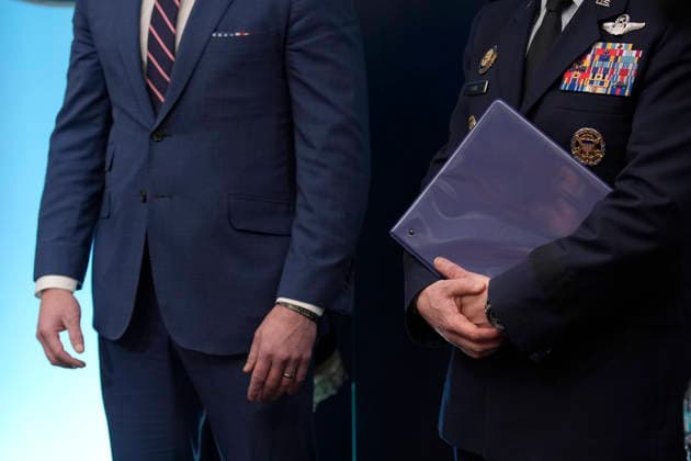 United States Secretary of War Pete Hegseth, left, and US Air Force General Dan Caine, Chair, Joint Chiefs of Staff, right, listen as US President Donald J Trump conducts a press conference in the James S Brady Press Briefing Room of the White House in Washington, DC, USA, on Monday April 6, 2026. The President is expected to take questions on the Iran War and oil prices. Copyright: xIndependentxStillxPoolxphotox 2026xAbacaUSAxfromxConsolidatedxNewsxPhotosxAllxRightsxReservex MediaPunchx