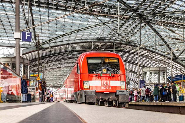 Berlin main station with train Passengers on platform Arriving train RegionalExpress RE2 to Cottbus 27 03 2026, Berlin, Germany