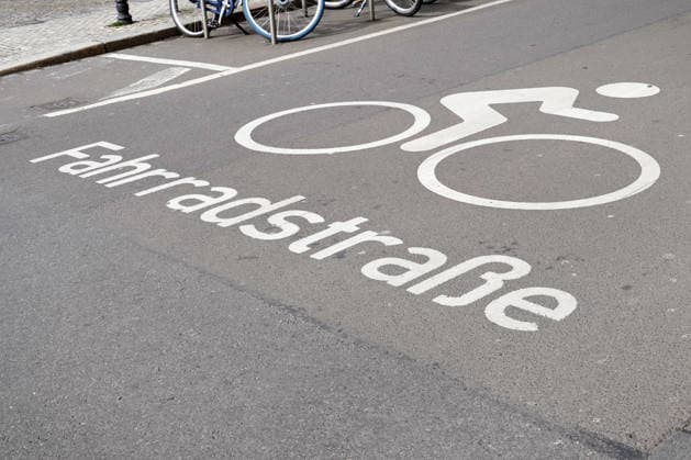 Traffic calming, secure Cycling in the City, Bicycle lane, Pictogram and Font at the Asphalt 1131608984