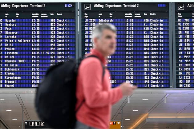 A passenger waits in front of a display board showing Lufthansa flights on the sidelines of the opening of Terminal 1 Pier at Munich Airport Franz Josef Strauß theme picture, symbolic picture Munich, 13 04 2026 Bavaria Germany Copyright: xDwixAnoraganingrumx
