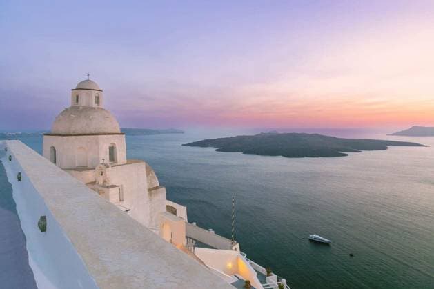 Church dome and Aegean Sea caldera at sunset in Fira on the island of Santorini, Greece Copyright: xkavalenkavax Panthermedia100656164.jpg