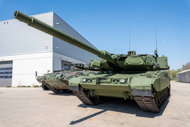Munich, Bavaria, Germany April 22, 2026: LEOPARD 2 main battle tanks and other tracked vehicles on the KNDS factory grounds in Munich-Allach on the occasion of the opening of a new Boxer production line