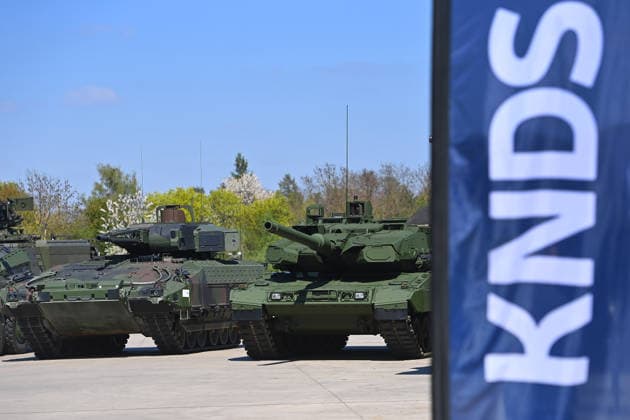 Battle tank LEOPARD 2 li armored personnel carrier PUMA KNDS flag,flag,logo,company logo,lettering,company emblem KNDS Opening of the new production line for the highly protected 8Ã-8 wheeled vehicle BOXER on 22 04 2026 in Munich