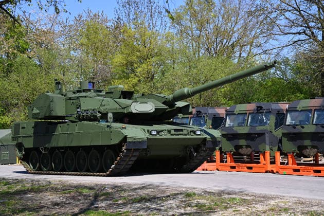 A new Leopard 2 main battle tank drives on the KNDS company premises Opening of the new production line for the highly protected 8Ã-8 wheeled vehicle BOXER on 22 04 2026 in Munich
