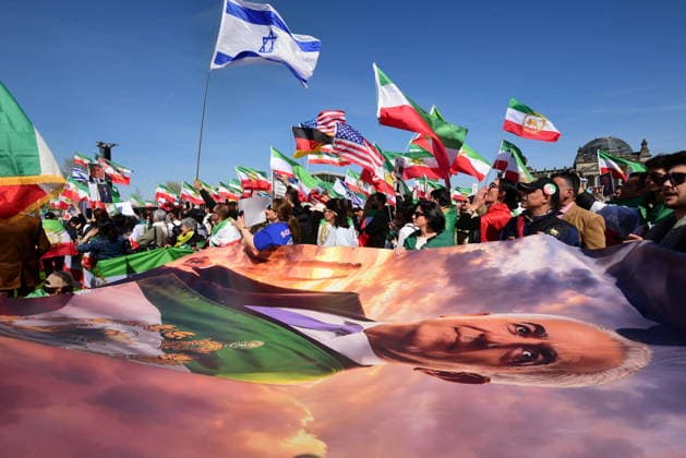 Supporters of Reza Pahlavi demonstrate in front of the Reichstag Demonstration for Reza Pahlavi