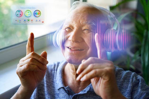 Smiling active senior listening to music with hologram indoors model released, Symbolfoto property released, AZF01256