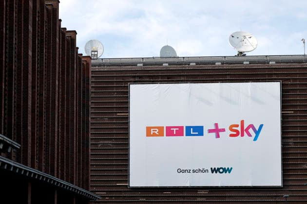 A poster near the headquarters of the TV station RTL on Picassoplatz in Cologne Deutz announces the merger of RTL and Sky RTL is in a crisis of quota pressure and strong streaming competition With the purchase of Sky Deutschland on June 1, 2026 for at least 150 million euros, the Cologne-based broadcaster is planning a liberating blow Theme image, symbolic image C Copyright: xChristophxHardtx