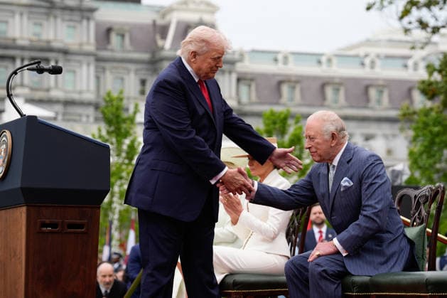 President Donald Trump shakes hands with Britain s King Charles III on the podium during an official welcoming ceremony at the White House in Washington DC on Tuesday, April 28, 2026. The king is on a four-day state visit to the U.S. and will stop in New York and Washington, where he will meet with U.S. officials and deliver an address to Congress. WAX20260428838 YURIxGRIPAS