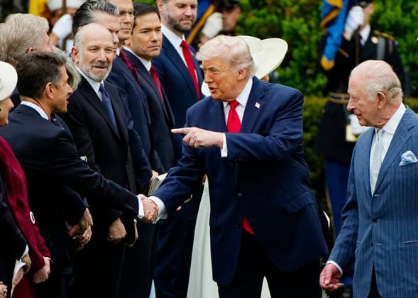 President Donald Trump shakes hands with Sir Christian Turner, the UK ambassador to the U.S., during an official arrival ceremony for Britain s King Charles III at the White House in Washington DC on Tuesday, April 28, 2026. The king is on a four-day state visit to the U.S. and will stop in New York and Washington, where he will meet with U.S. officials and deliver an address to Congress. WAP20260428920 BONNIExCASH