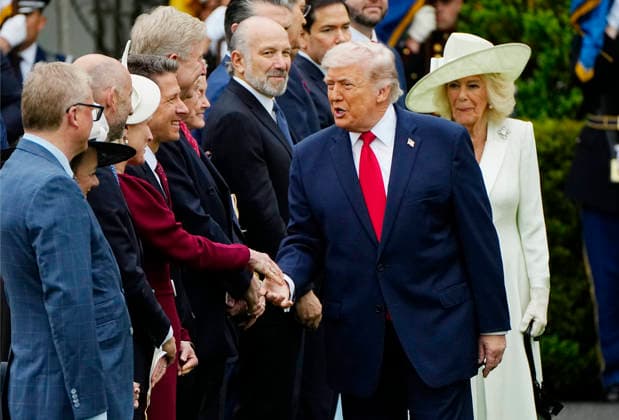 President Donald Trump shakes hands with a member of the British delegation during an official arrival ceremony for Britain s King Charles III at the White House in Washington DC on Tuesday, April 28, 2026. The king is on a four-day state visit to the U.S. and will stop in New York and Washington, where he will meet with U.S. officials and deliver an address to Congress. WAP20260428921 BONNIExCASH