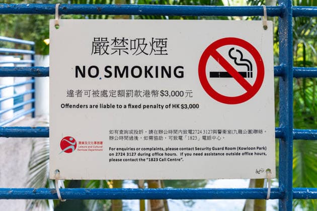 People s Republic of China, Hong Kong April 26, 2026: A no-smoking sign in Hong Kong highlights clear rules and penalties. The image illustrates health prevention, legal regulations, and the enforcement of order in public spaces.