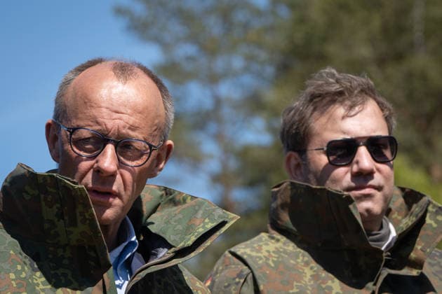 Federal Chancellor Friedrich Merz on the left with his Vice-Chancellor and Federal Finance Minister Lars Klingbeil Federal Chancellor Friedrich Merz visits the Bundeswehr army, Munster Lower Saxony Germany Munster military training area