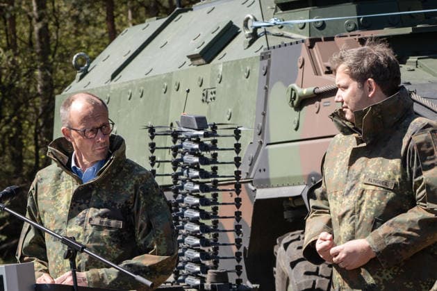 Federal Chancellor Friedrich Merz on the left with his Vice-Chancellor and Federal Finance Minister Lars Klingbeil Federal Chancellor Friedrich Merz visits the Bundeswehr army, Munster Lower Saxony Germany Munster military training area