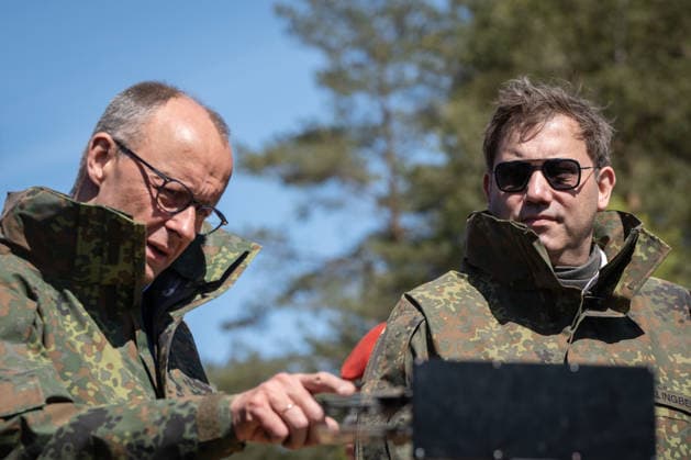 Federal Chancellor Friedrich Merz on the left with his Vice-Chancellor and Federal Finance Minister Lars Klingbeil Federal Chancellor Friedrich Merz visits the Bundeswehr army, Munster Lower Saxony Germany Munster military training area