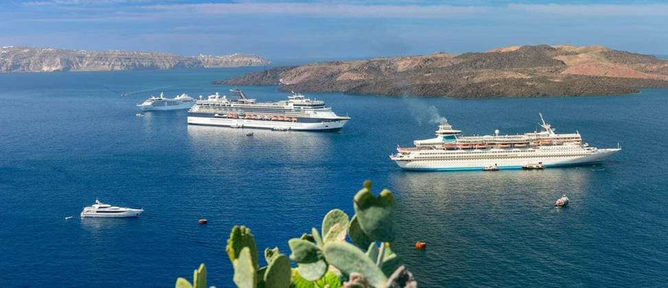 Multiple cruise ships anchored in the caldera near Santorini, Greece Copyright: xkavalenkavax Panthermedia101162638.jpg