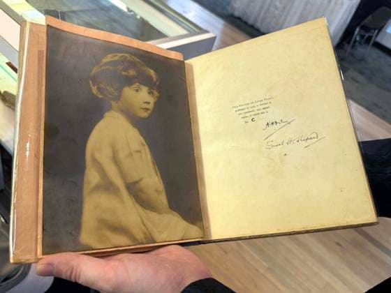 April 30, 2026, New York, New York, USA: Portrait of Christopher Robin Milne, son of the author, seen on the inside cover of Winnie the Pooh,1926 edition limited to 200 copies, signed by author A.A. Milne and illustrator E. H. Shepard, offered by Black Swan Books for $19,500,00 seen at the press preview for the ABAA New York International Antiquarian Book Fair held at the Park Avenue Armory. New York USA - ZUMAk03_ 20260430_zaf_k03_021 Copyright: xNancyxKaszermanx