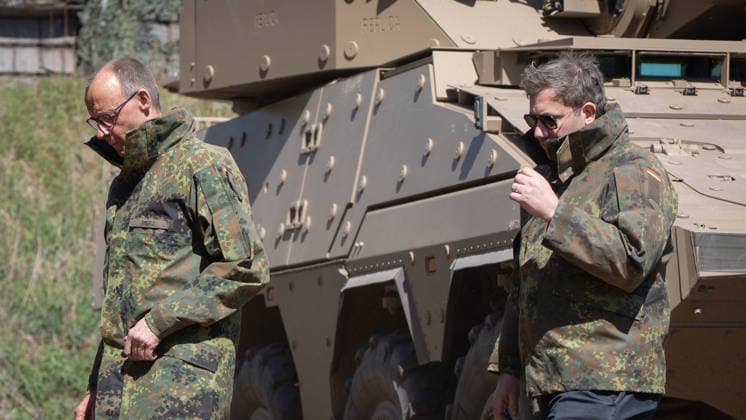 Federal Chancellor Friedrich Merz on the left with his Vice-Chancellor and Federal Finance Minister Lars Klingbeil Federal Chancellor Friedrich Merz visits the Bundeswehr army, Munster Lower Saxony Germany Munster military training area