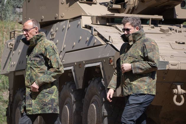 Federal Chancellor Friedrich Merz on the left with his Vice-Chancellor and Federal Finance Minister Lars Klingbeil Federal Chancellor Friedrich Merz visits the Bundeswehr army, Munster Lower Saxony Germany Munster military training area