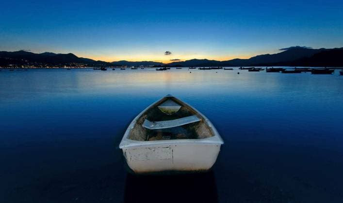 sunset on the lake, boat Copyright: xcozytax Panthermedia69651566.jpg