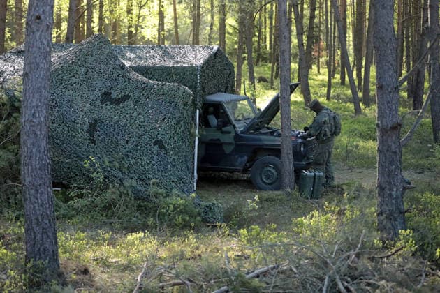 A Mercedes Wolf vehicle of the German Armed Forces with open hood in the forest on the Munster military training area A Mercedes Wolf vehicle of the German Armed Forces with open hood in the forest on the Munster military training area Munster Lower Saxony Germany