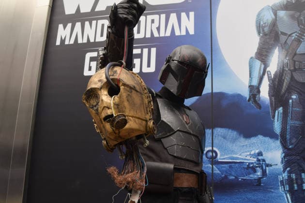 May 4, 2026, London, England, United Kingdom: A performer wearing a Mandalorian costume holds the severed head of C-3PO outside the Disney store on Oxford Street on Star Wars Day. The beloved sci-fi franchise is celebrated each year on May 4th, a pun on the famous phrase May The Force Be With You. London United Kingdom - ZUMAv130 20260504_zip_v130_008 Copyright: xVukxValcicx