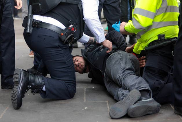 . 04 05 2026. London, United Kingdom. London May Day March. Police detain two men at the annual London May Day March from Clerkenwell Green to Trafalgar Square.where a rally is held.  xMartynxWheatleyx xi-Imagesx IIM-26745-0005