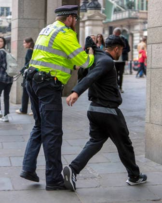 . 04 05 2026. London, United Kingdom. London May Day March. Police detain two men at the annual London May Day March from Clerkenwell Green to Trafalgar Square.where a rally is held.  xMartynxWheatleyx xi-Imagesx IIM-26745-0006
