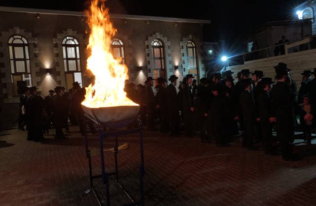 (260505) -- MODI IN, May 5, 2026 -- Ultra-Orthodox Jewish people attend a fire burning ceremony as they celebrate the Jewish holiday of Lag BaOmer in Modi in, Israel, May 4, 2026. (Photo by Xinhua) ISRAEL-MODI IN-LAG BAOMER-CELEBRATION GilxCohenxMagen 