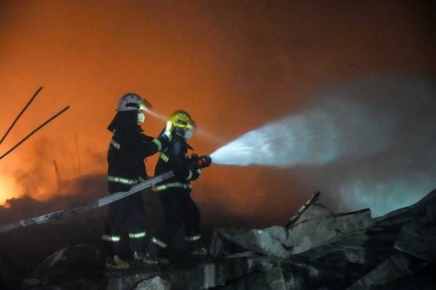 (260505) -- CHANGSHA, May 5, 2026 -- Rescuers work on site after an explosion at a fireworks plant in Guandu Town of Liuyang, central China s Hunan Province, in the early hours of May 5, 2026. The fireworks plant explosion on Monday in central China s Hunan Province has left 21 people dead and 61 others injured, authorities said Tuesday. The explosion occurred at around 4:43 p.m. Monday at the plant of Huasheng fireworks manufacturing and display company in Liuyang, a county-level city under Changsha, capital city of Hunan. More than 480 rescuers in five teams have been mobilized for the rescue, with three rescue robots deployed. ) (SpotNews) CHINA-HUNAN-LIUYANG-FIREWORKS PLANT-EXPLOSION (CN) ChenxSihan 