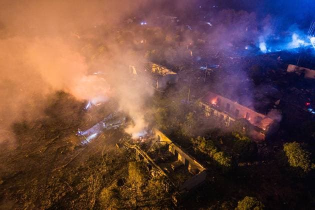 (260505) -- CHANGSHA, May 5, 2026 -- This aerial drone photo taken in the early hours of May 5, 2026 shows rescuers working on site after an explosion at a fireworks plant in Guandu Town of Liuyang, central China s Hunan Province. The fireworks plant explosion on Monday in central China s Hunan Province has left 21 people dead and 61 others injured, authorities said Tuesday. The explosion occurred at around 4:43 p.m. Monday at the plant of Huasheng fireworks manufacturing and display company in Liuyang, a county-level city under Changsha, capital city of Hunan. More than 480 rescuers in five teams have been mobilized for the rescue, with three rescue robots deployed. ) (SpotNews) CHINA-HUNAN-LIUYANG-FIREWORKS PLANT-EXPLOSION (CN) Che 