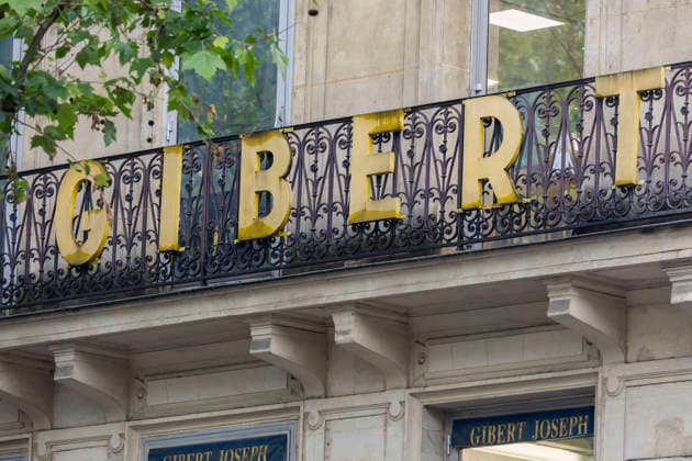 Paris, France May 4, 2026 - People walk past the Gibert Joseph bookstore on Boulevard Saint-Michel. The legendary bookstore in the Latin Quarter announced on April 28 that it had filed for bankruptcy protection. Facing financial difficulties, it is seeking to adapt its business model, at a time when one in five books purchased in France is secondhand. ECONOMIE, LIBRAIRIE GIBERT JOSEPH, ILLUSTRATION, GENERIQUE, RIVE GAUCHE, LIVRES, BANQUEROUTE, DIFFICULTES FINANCIERE, ENSEIGNE, LIBRAIRE, LECTURE, LIRE, REDRESSEMENT JUDICIAIRE, LECTEURS, LIVRES NEUFS, LIVRES D OCCASION, LIBRAIRIE INDEPENDANTE, COMMERCE EN LIGNE, ECOMMERCE Copyright: xVincentxIsorex