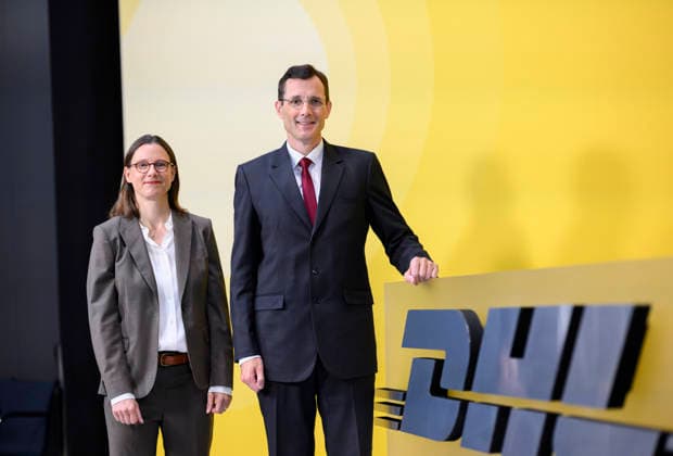 Tobias Meyer CEO, Chairman of the Board of Management and Katrin Suder Chairwoman of the Supervisory Board in front of a DHL logo Annual General Meeting of Deutsche Post AG, on 05 05 2026 in Bonn Germany @ World Conference Center