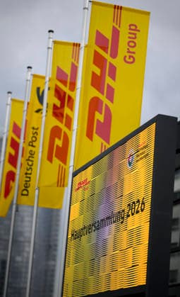 Banners and flags of DHL with logo in front of the HPV Annual General Meeting of Deutsche Post AG, on 05 05 2026 in Bonn Germany @ World Conference Center