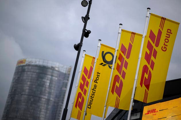 Banners and flags of DHL with logo in front of the HPV in the background the Posttower Annual General Meeting of Deutsche Post AG, on 05 05 2026 in Bonn Germany @ World Conference Center