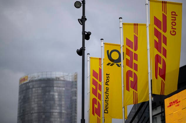Banners and flags of DHL with logo in front of the HPV in the background the Posttower Annual General Meeting of Deutsche Post AG, on 05 05 2026 in Bonn Germany @ World Conference Center
