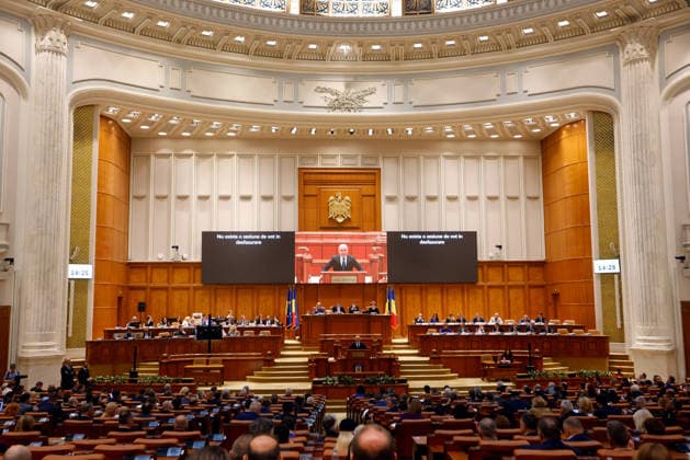 (260505) -- BUCHAREST, May 5, 2026 -- Members of Romania s bicameral parliament attend a no-confidence vote against Prime Minister Ilie Bolojan s government at Parliament Palace in Bucharest, Romania, May 5, 2026. Romania s bicameral parliament passed a no-confidence motion against Prime Minister Ilie Bolojan s government on Tuesday, with 281 votes in favor and 4 against, bringing down the government, according to the parliament s live broadcast of the vote. (Photo by Xinhua) ROMANIA-BUCHAREST-NO-CONFIDENCE MOTION-PASS CristianxCristel 