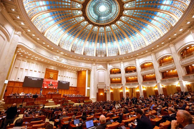 (260505) -- BUCHAREST, May 5, 2026 -- Members of Romania s bicameral parliament attend a no-confidence vote against Prime Minister Ilie Bolojan s government at Parliament Palace in Bucharest, Romania, May 5, 2026. Romania s bicameral parliament passed a no-confidence motion against Prime Minister Ilie Bolojan s government on Tuesday, with 281 votes in favor and 4 against, bringing down the government, according to the parliament s live broadcast of the vote. (Photo by Xinhua) ROMANIA-BUCHAREST-NO-CONFIDENCE MOTION-PASS CristianxCristel 