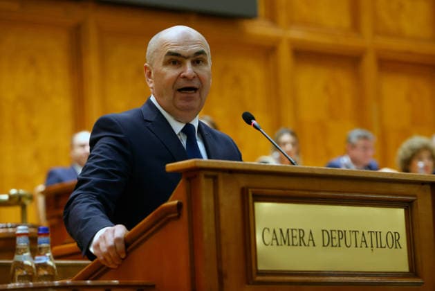 (260505) -- BUCHAREST, May 5, 2026 -- Romania s Prime Minister Ilie Bolojan speaks during a no-confidence vote against his government at Parliament Palace in Bucharest, Romania, May 5, 2026. Romania s bicameral parliament passed a no-confidence motion against Prime Minister Ilie Bolojan s government on Tuesday, with 281 votes in favor and 4 against, bringing down the government, according to the parliament s live broadcast of the vote. (Photo by Xinhua) ROMANIA-BUCHAREST-NO-CONFIDENCE MOTION-PASS CristianxCristel 