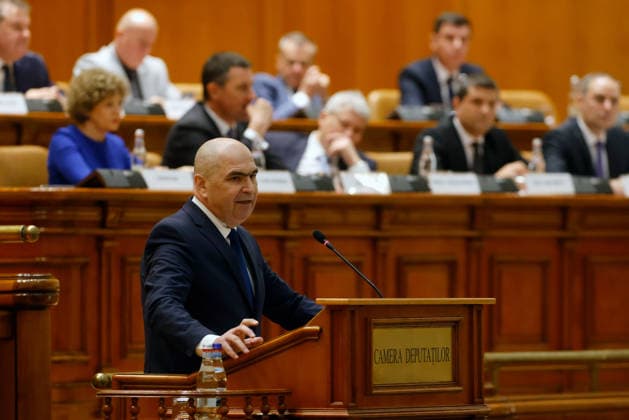 (260505) -- BUCHAREST, May 5, 2026 -- Romania s Prime Minister Ilie Bolojan speaks during a no-confidence vote against his government at Parliament Palace in Bucharest, Romania, May 5, 2026. Romania s bicameral parliament passed a no-confidence motion against Prime Minister Ilie Bolojan s government on Tuesday, with 281 votes in favor and 4 against, bringing down the government, according to the parliament s live broadcast of the vote. (Photo by Xinhua) ROMANIA-BUCHAREST-NO-CONFIDENCE MOTION-PASS CristianxCristel 