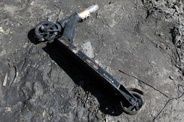 A fire-stricken kick scooter lies on the ground in the yard of a house affected by a Russian drone strike in Dnipro, Ukraine, May 5, 2026. As a result of the attack, one person was injured. Three private houses and a critical infrastructure facility were also damaged in the city. (Photo by Mykola Miakshykov Ukrinform) Russian drone strike hits residential area in Dnipro  Copyright: xMykolaxMiakshykovx