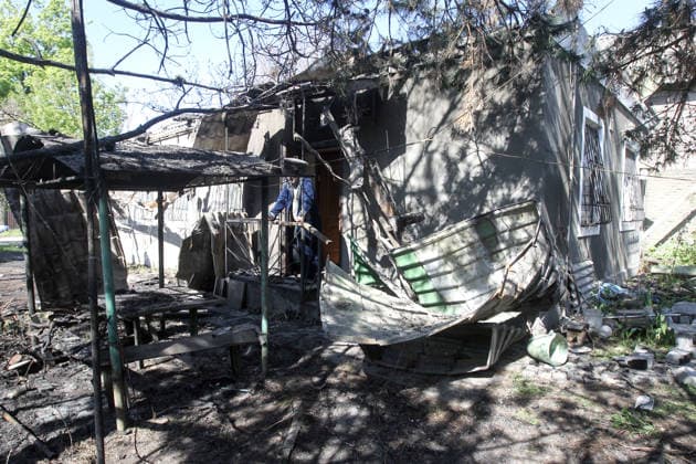 A man stands on the porch of a house damaged by a Russian drone strike in Dnipro, Ukraine, May 5, 2026. As a result of the attack, one person was injured. Three private houses and a critical infrastructure facility were also damaged in the city. (Photo by Mykola Miakshykov Ukrinform) Russian drone strike hits residential area in Dnipro  Copyright: xMykolaxMiakshykovx