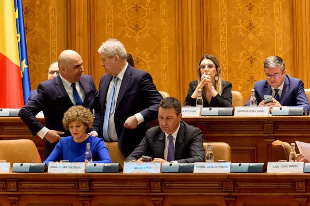 PM Bolojan Dismissed as Romanian Government, Bucharest, Romania Bucharest, Romania. 5th May, 2026: Romanian Prime Minister Ilie Bolojan (L), speaks with Catalin Predoiu, Minister of Internal Affairs, during the vote on the motion of no confidence filed against his government by PSD, AUR, and PACE at the Romanian Parliament. The government was dismissed following the vote. Bucharest Romania Copyright: xLucianxAlecux