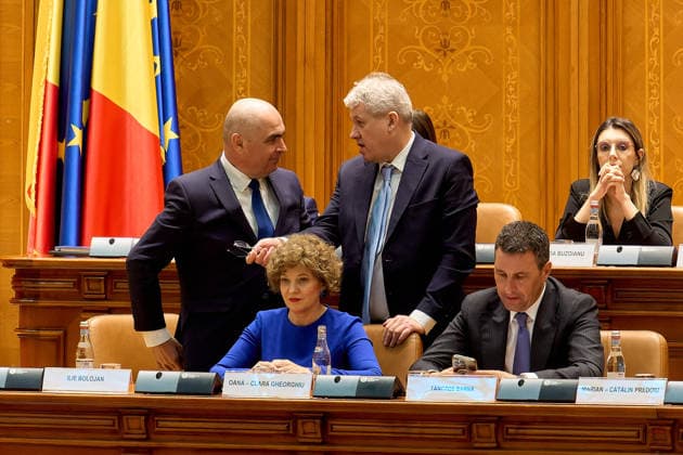 PM Bolojan Dismissed as Romanian Government, Bucharest, Romania Bucharest, Romania. 5th May, 2026: Romanian Prime Minister Ilie Bolojan (L), speaks with Catalin Predoiu, Minister of Internal Affairs, during the vote on the motion of no confidence filed against his government by PSD, AUR, and PACE at the Romanian Parliament. The government was dismissed following the vote. Bucharest Romania Copyright: xLucianxAlecux