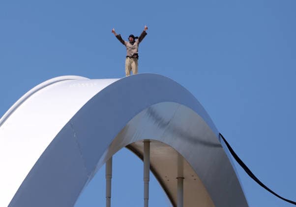 May 5, 2026, Washington, District Of Columbia, USA: Activist Guido Reichstadter stands and waves to other protesters down on the ground as he remains atop the Frederick Douglass Memorial Bridge in Washington DC, USA, on May 05, 2026. Reichstadter climbed onto the bridge on May 1 and has remained there in protest of what he described as the Trump regime s war in Iran and against AI development. Washington USA - ZUMAs337 20260505_znp_s337_004 Copyright: xGentxShkullakux