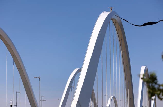 May 5, 2026, Washington, District Of Columbia, USA: Activist Guido Reichstadter stands and waves to other protesters down on the ground as he remains atop the Frederick Douglass Memorial Bridge in Washington DC, USA, on May 05, 2026. Reichstadter climbed onto the bridge on May 1 and has remained there in protest of what he described as the Trump regime s war in Iran and against AI development. Washington USA - ZUMAs337 20260505_znp_s337_007 Copyright: xGentxShkullakux