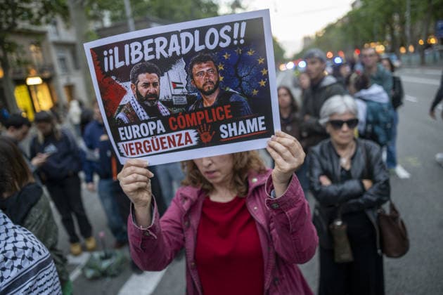 Protesters gather outside the EU offices over detention of Freedom Flotilla activists in Barcelona BARCELONA, SPAIN - MAY 05: Protesters, carrying Palestinian flags and signs, gather outside the European Commission headquarters to protest against the continued detention of Freedom Flotilla activists Saif Abukeshek and Thiago Avila by Israeli authorities in Barcelona, Spain, on May 5, 2026. During the rally, speakers also criticized the European Union for what they called its silence regarding the situation of the two activists chanting against the Israeli government and in support of Palestine were heard throughout the protest. Lorena Sopena Lopez Anadolu Barcelona Spain. Editorial use only. Please get in touch for any other usage.  Copyright: x2026xAnadoluxLorenaxSopenaxLopezx