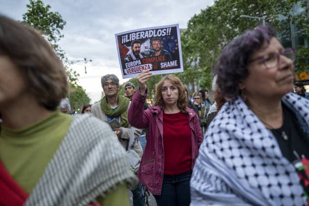 Protesters gather outside the EU offices over detention of Freedom Flotilla activists in Barcelona BARCELONA, SPAIN - MAY 05: Protesters, carrying Palestinian flags and signs, gather outside the European Commission headquarters to protest against the continued detention of Freedom Flotilla activists Saif Abukeshek and Thiago Avila by Israeli authorities in Barcelona, Spain, on May 5, 2026. During the rally, speakers also criticized the European Union for what they called its silence regarding the situation of the two activists chanting against the Israeli government and in support of Palestine were heard throughout the protest. Lorena Sopena Lopez Anadolu Barcelona Spain. Editorial use only. Please get in touch for any other usage.  Copyright: x2026xAnadoluxLorenaxSopenaxLopezx